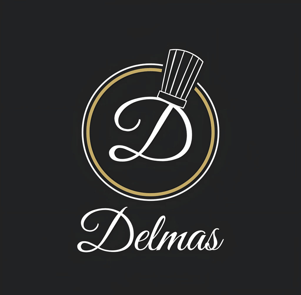 Logo Delmas Élégant : Chef Pâtissier, Typographie Or Logo Delmas : lettre 'D' stylisée en blanc superposée à un chapeau de chef, encadrée par des cercles blanc et or, sur fond noir charbon.